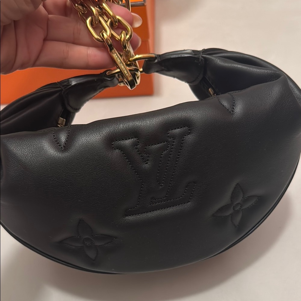 Louis Vuitton Black and Gold Shoulder Bag with Sleek Design